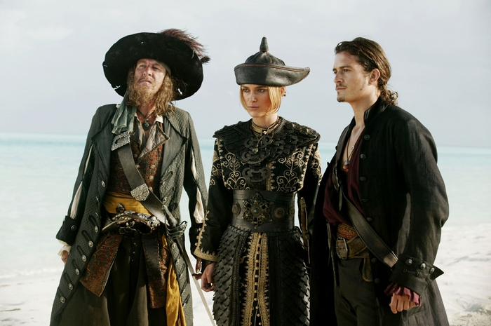 Hector Barbossa and two companions on a beach