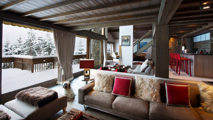 Cozy living room with a view of a snowy forest