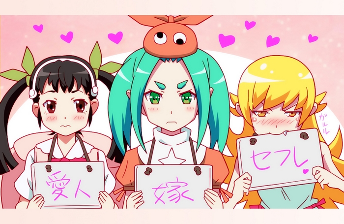 Three girls holding signs with Japanese text