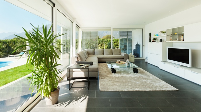 Modern living room with large windows and a sectional sofa