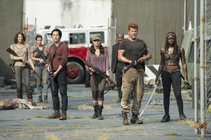 Michonne and survivors with weapons