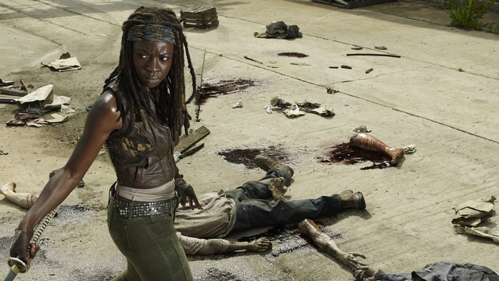 Michonne from The Walking Dead with sword and dead bodies