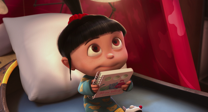 Agnes from Despicable Me holding a book