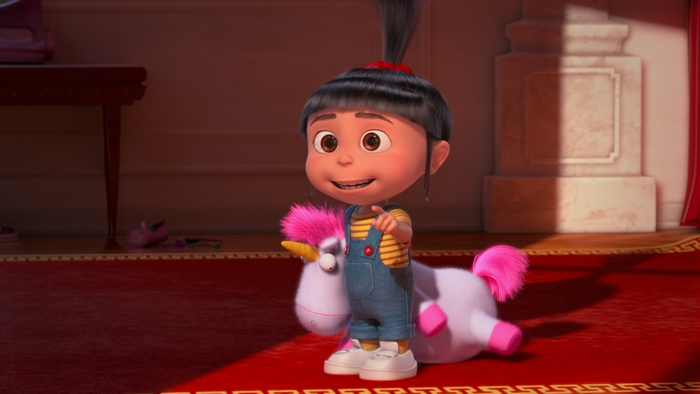 Agnes from Despicable Me with a unicorn toy