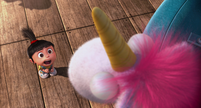 Agnes from Despicable Me with a unicorn toy