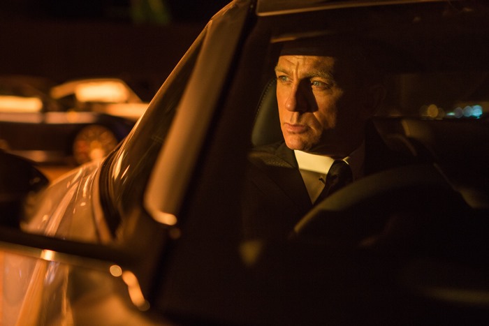 James Bond driving a car at night