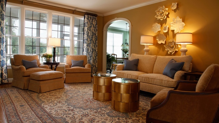 Living room with floral curtains and ornate rug