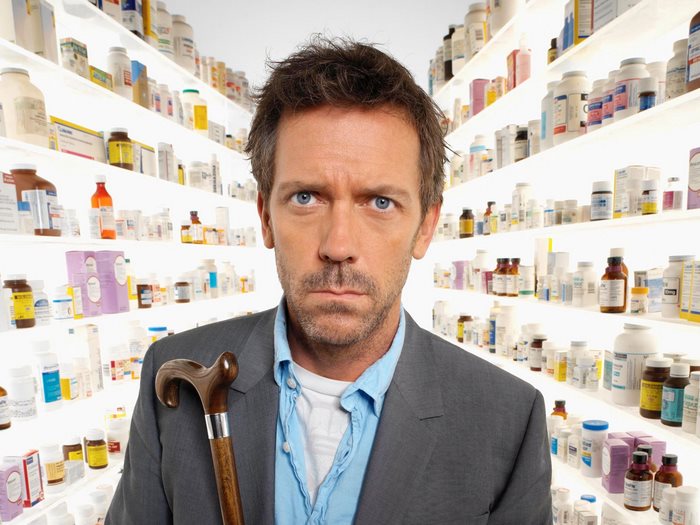 Gregory House with cane in pharmacy