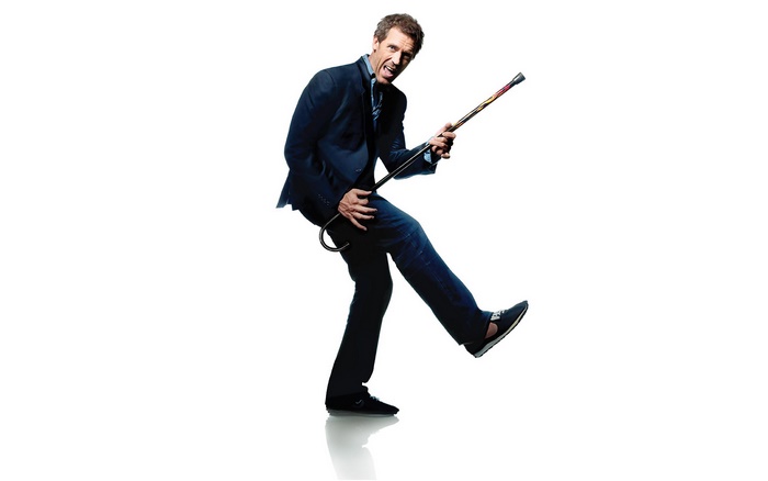 Gregory House playing air guitar with a cane
