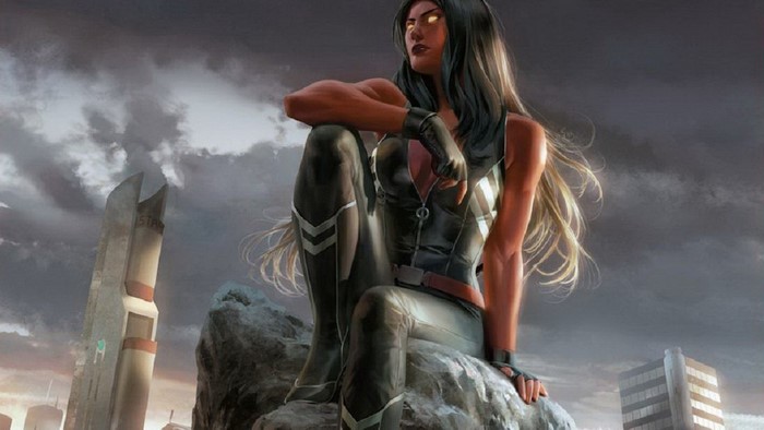 She-Hulk sitting on a rock in a ruined city
