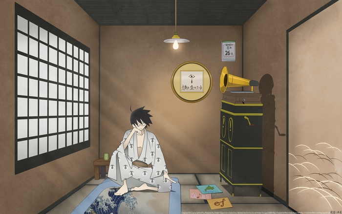 Nozomu Itoshiki sitting in a room with a gramophone