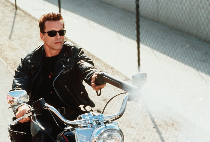 Arnold Schwarzenegger as the Terminator on a motorcycle