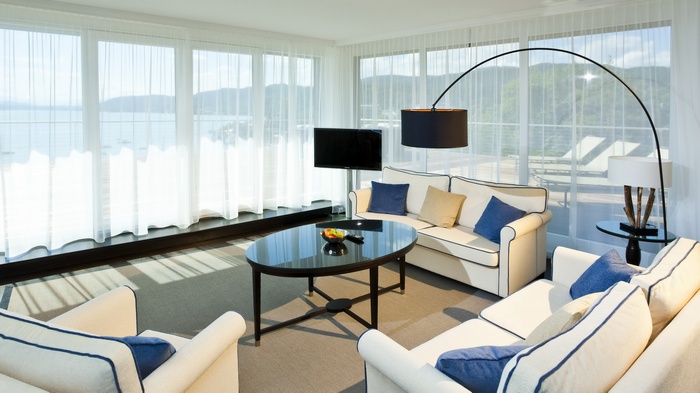 Living room with a view of the water and mountains