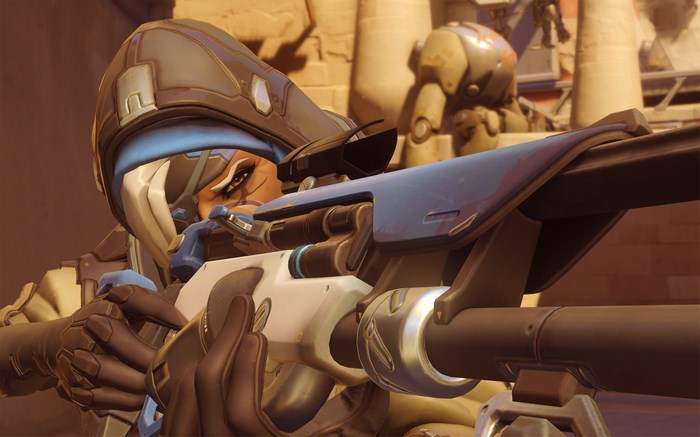 Ana from Overwatch aiming a sniper rifle