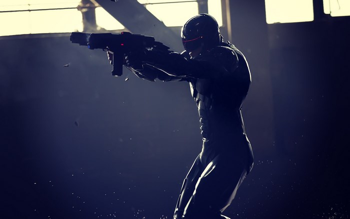 RoboCop aiming a weapon in a dark industrial setting