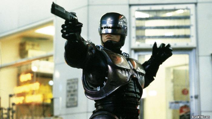 RoboCop holding a handgun