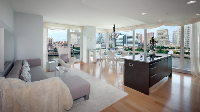 Modern living room and kitchen with city view