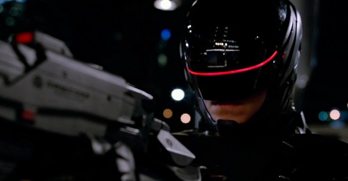 RoboCop holding a gun