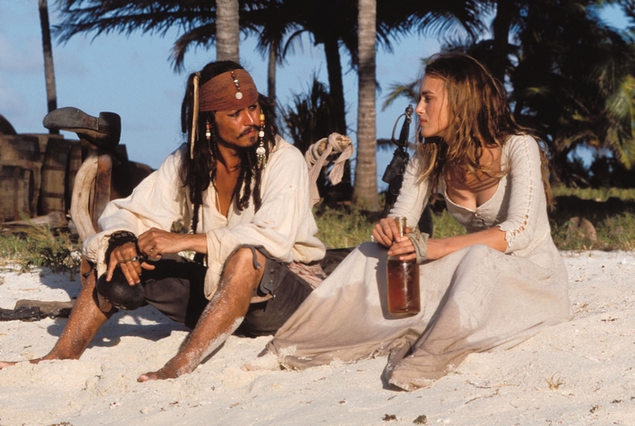 Captain Jack Sparrow and Elizabeth Swann on a beach