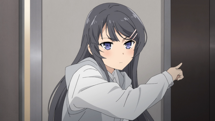 Determined Mai Sakurajima Pointing with Serious Expression