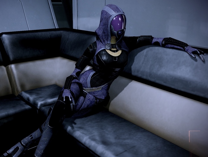 Tali Zorah from Mass Effect sitting on a couch