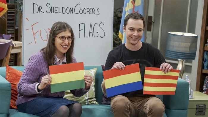 Amy Farrah Fowler and Sheldon Cooper with flags