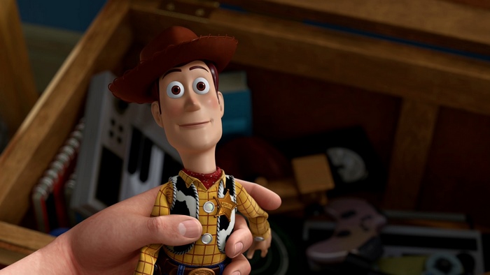 Woody from Toy Story in a toy chest