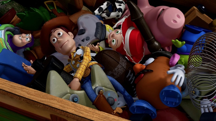 Woody and other toys in a pile