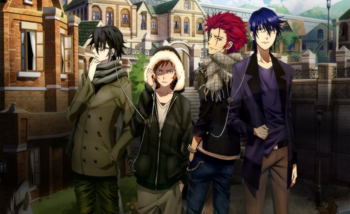 Four men standing in front of a building