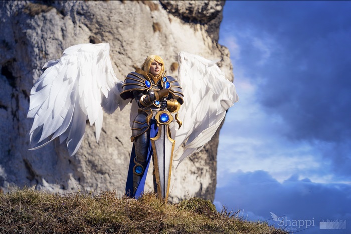 Kayle from League of Legends with wings and sword