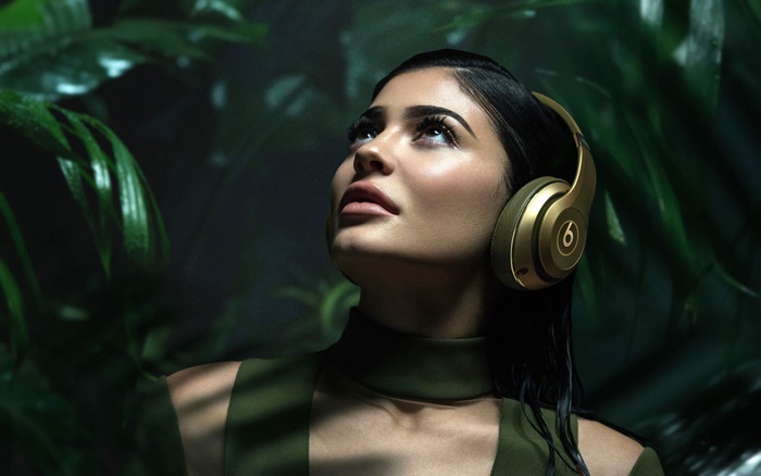 Kylie Jenner wearing Beats headphones in jungle