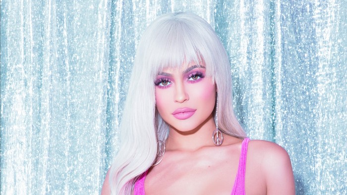 Kylie Jenner with peace sign earrings