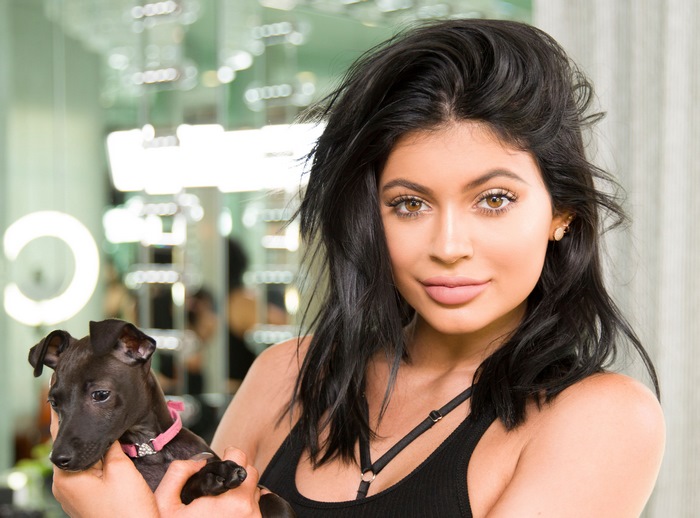 Kylie Jenner holding a puppy