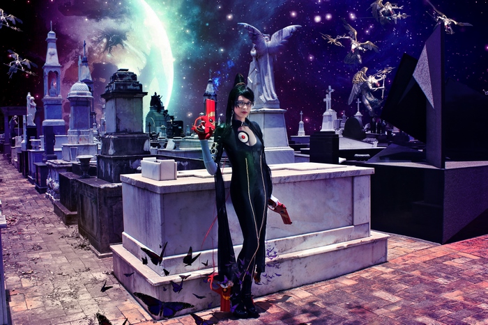 Bayonetta in a graveyard with a planet in the background