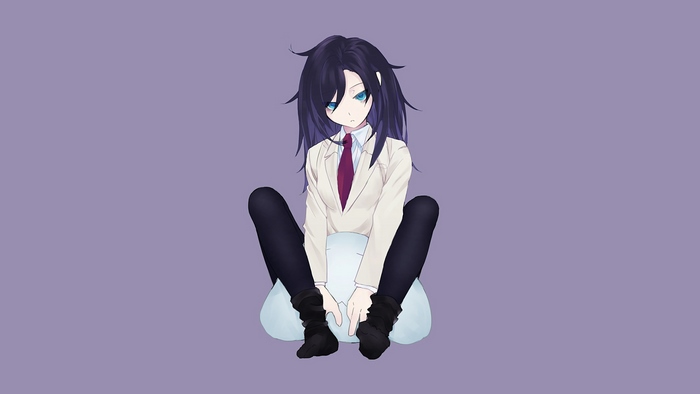 Tomoko Kuroki sitting on a pillow