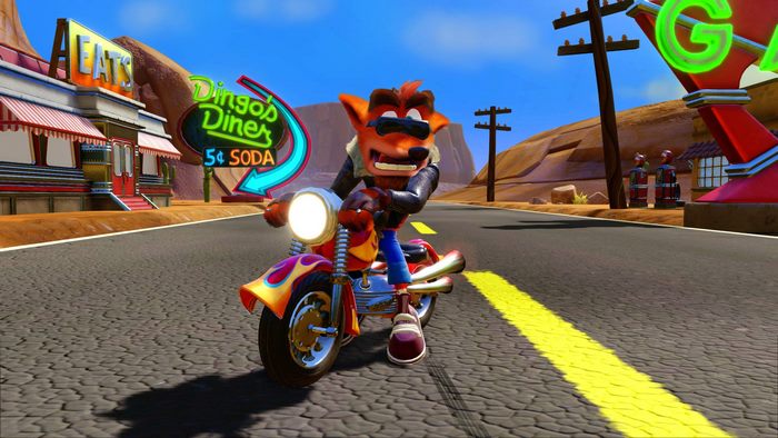 Crash Bandicoot riding a motorcycle near Dingo's Diner