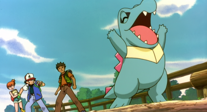 Ash, Misty, and Brock with a Totodile