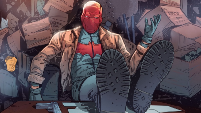 Red Hood sitting with feet on desk