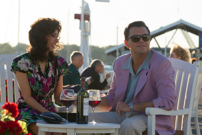 Jordan Belfort and woman at outdoor cafe