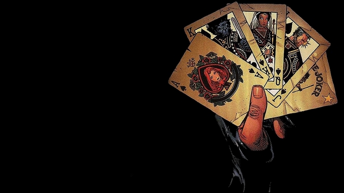 Gambit holding playing cards