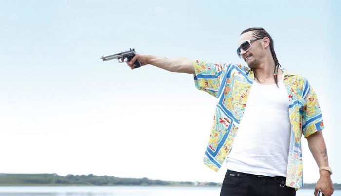 James Franco holding a gun