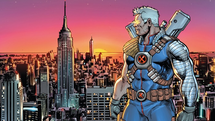 Cable standing in front of New York City skyline