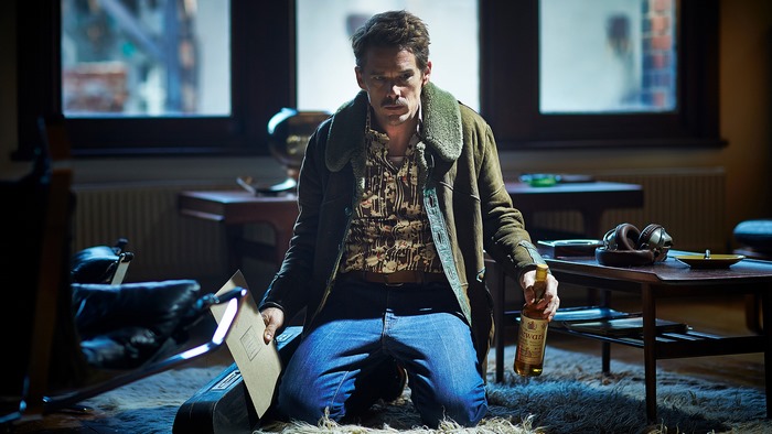 Ethan Hawke in a room with a bottle