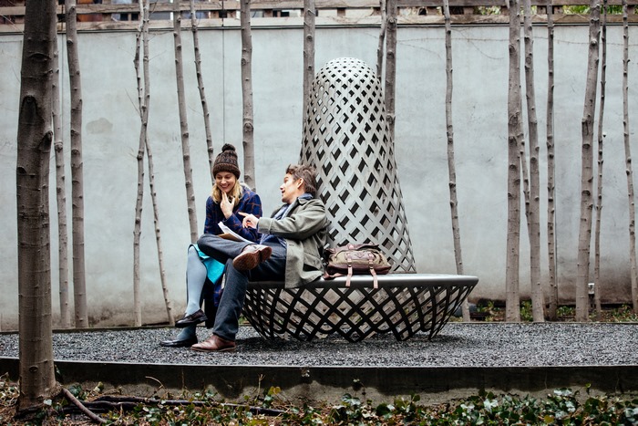 Ethan Hawke and woman sitting on bench