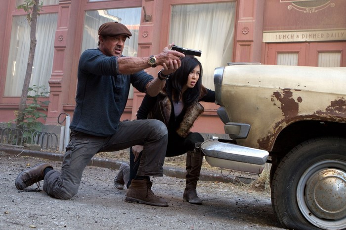 Barney Ross from The Expendables aiming a gun