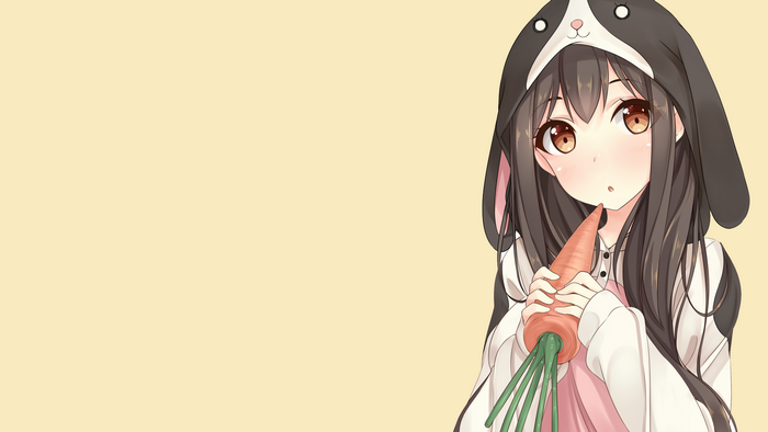 Girl in bunny hoodie holding carrot
