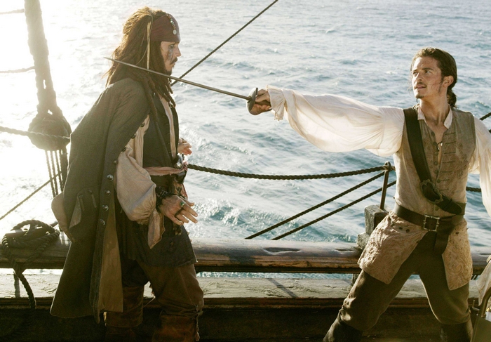 Will Turner and Jack Sparrow sword fighting on a ship