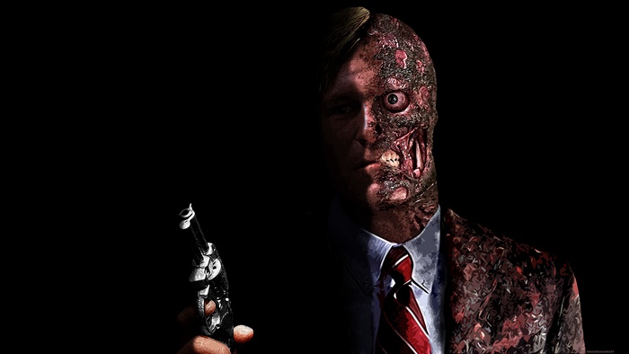 Two-Face holding a gun