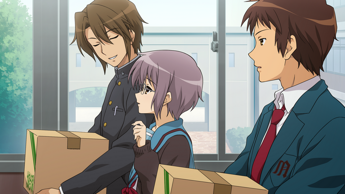 Itsuki Koizumi and two students carrying boxes