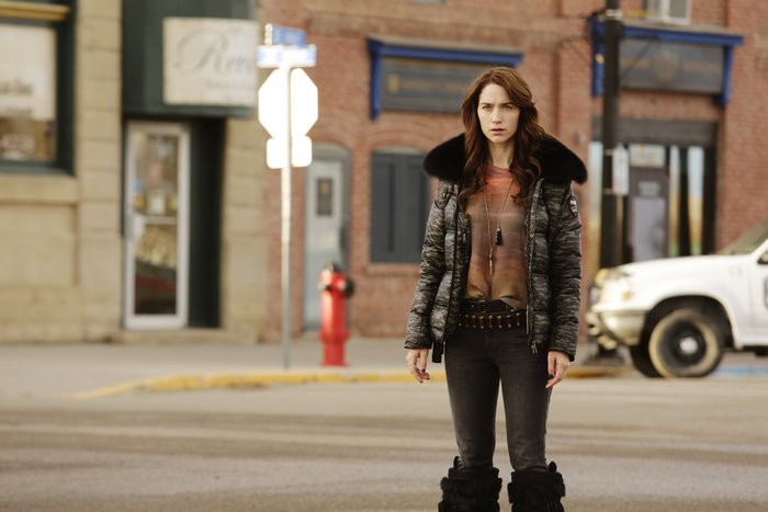 Wynonna Earp standing in a street